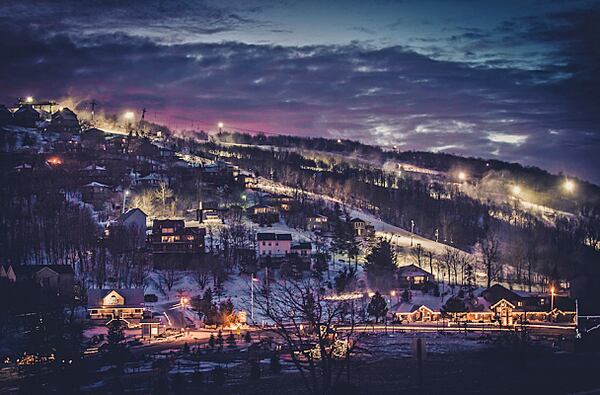 A nighttime Beech Moutain Resort blanketed by snow