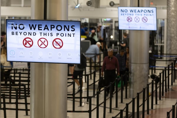 Passengers head through the security check at Hartsfield-Jackson International Airport in Atlanta. (Steve Schaefer/AJC 2022)