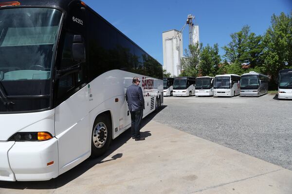 Tom Sambdman, co-owner of Samson Tours whose coaches and school buses sit idle, is waiting for federal relief loans and trying to decide how to use them on Wednesday, April 15, 2020, in Atlanta. The company wants to pay their staff of 72 employees but has no work for them until the summer. Curtis Compton ccompton@ajc.com