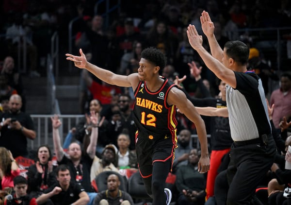 Atlanta Hawks' forward De'Andre Hunter (12) celebrates after scoring during the first half in Game 4 of the first round of the Eastern Conference playoffs at State Farm Arena, Sunday, April 23, 2023, in Atlanta. (Hyosub Shin / Hyosub.Shin@ajc.com)