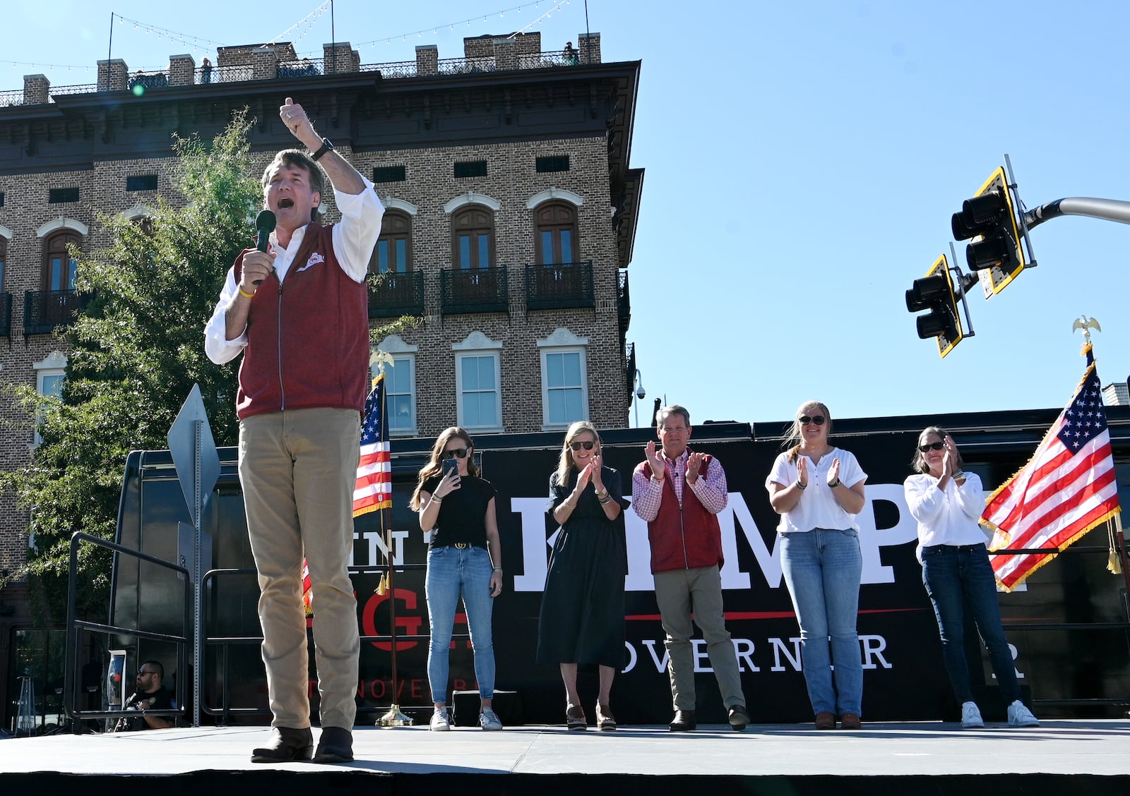 Virginia Gov. Glenn Youngkin speaks during a rally Tuesday in Alpharetta supporting Georgia Gov. Brian Kemp's bid for reelection. Youngkin, who scored an upset in Virginia when he won the governor's race there in 2021, called that victory “a big statement for change." He then told hundreds of cheering people at the rally: "Now it’s your turn to make a big Georgia statement that we’re going to give Brian Kemp four more years.” (Hyosub Shin / Hyosub.Shin@ajc.com)