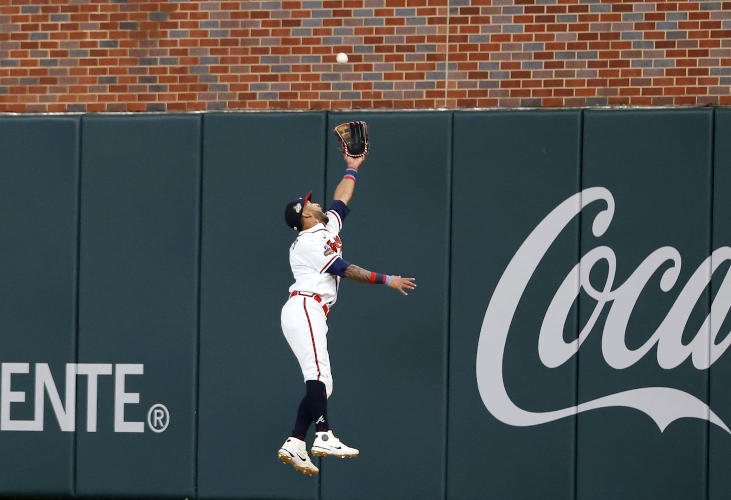 Braves right fielder Eddie Rosario tries to catch a ball Monday night at Truist Park. (Miguel Martinez/miguel.martinezjimenez@ajc.com)