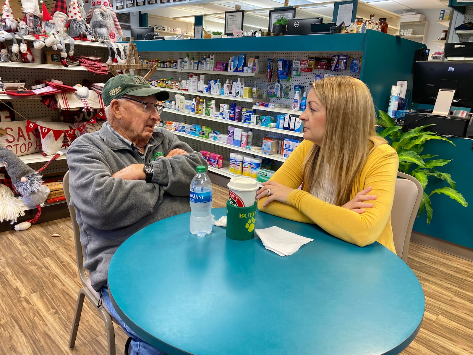 Pharmacist Danica Robertson and friend, Robert Blan, reminisce about the coffee club that has existed at Sherwood's Drug Shop in Buford, GA for decades.
(Keri Janton for The Atlanta Journal-Constitution)