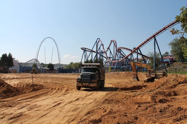 Ground work proceeds on the site of the new Justice League: Battle for Metropolis ride at Six Flags Over Georgia on Wednesday. The Superman Ultimate Flight roller coaster is in the background. The Justice League attraction will be an indoor ride that takes guests on an interactive journey through Metropolis where they battle the DC Comics supervillains and get help from Batman, Superman and other heroes. TOM KELLEY / TKELLEY@AJC.COM