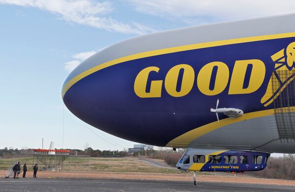 The ground crew stands by as the blimp takes off for a short flight around Atlanta. Bob Andres / bandres@ajc.com