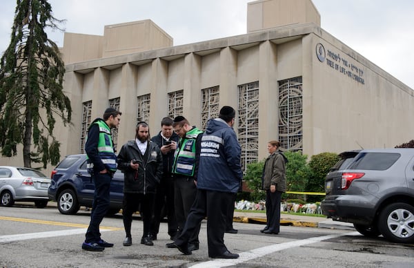 A Jewish emergency crew and police officers at the site of the mass shooting that killed 11 people and wounded 6 at the Tree Of Life Synagogue on October 28, 2018 in Pittsburgh, Pennsylvania. Suspected gunman Richard Bowers, 46, has been charged with 29 federal counts in the mass shooting that police say was fueled by antisemitism. Suspected gunman Richard Bowers, 46, has been charged with 29 federal counts in the mass shooting that police say was fueled by antisemitism.  (Photo by Jeff Swensen/Getty Images)