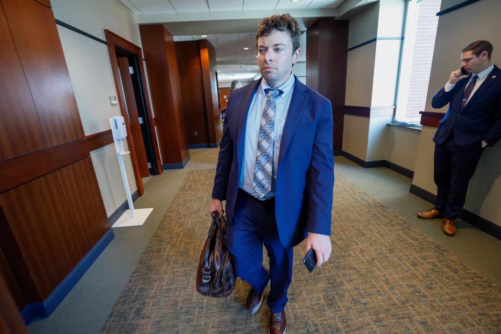 Attorney Reid M. Kennedy heads to a courtroom on the 7th floor of the Cobb County Superior Court building on Thursday, August 8, 2024. Chief Judge Gregory Poole issued a 30-day emergency order on Wednesday, suspending filing deadlines and other administrative requirements in civil and criminal cases.
(Miguel Martinez / AJC)