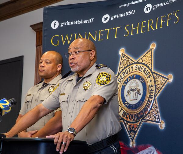 Gwinnett County Sheriff Keybo Taylor, right, addresses the news media at the Gwinnett Sheriff's Office in Lawrenceville as Chief Cleophas Atwater, left, listens on June 29, 2021. (Jenni Girtman for The Atlanta Journal-Constitution)