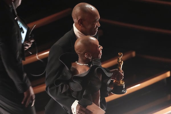 Cynthia Erivo, left, embraces Paul Tazewell, winner of the award for best costume design for "Wicked" during the Oscars on Sunday, March 2, 2025, at the Dolby Theatre in Los Angeles. (AP Photo/Chris Pizzello)