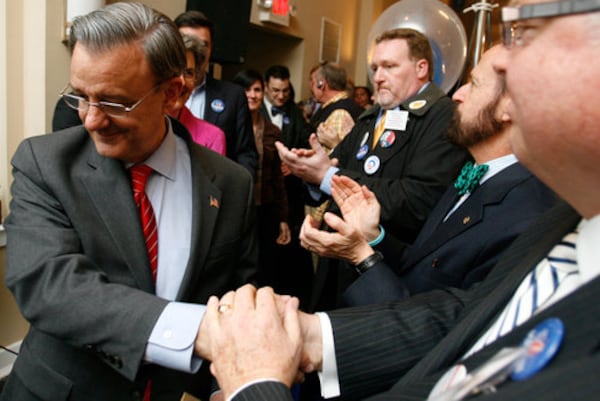 Supporters greet Democrat Jim Martin as he enters his election party after Republican U.S. Sen. Saxby Chambliss beat him in a 2008 runoff by 14 percentage points. In the general election, Martin trailed Chambliss by only 3 points.