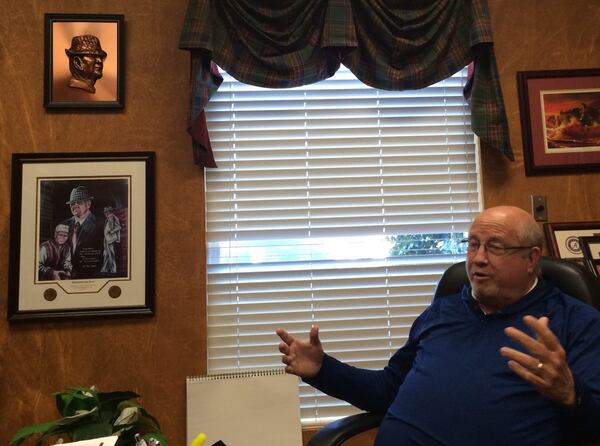 Pastor Jerry Walls at Southside Baptist Church wears his Alabama allegiance on his walls, but his Jake Fromm allegiance a little closer to his heart. (Steve Hummer/shummer@ajc.com)