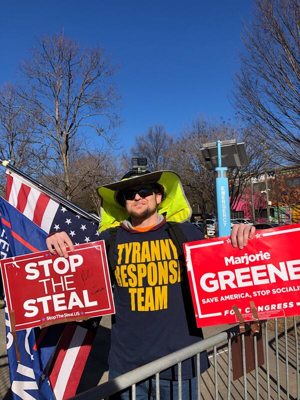 Matt Gault of Woodstock protests at The King Center.