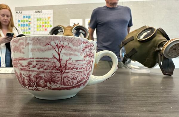 Props from Peacock's "Teacup" including an actual teacup and a chemical respirator on a media visit at Assembly Studios in Doraville on May 22, 2024. RODNEY HO/rho@ajc.com