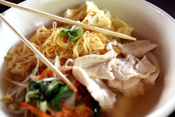 Chicken Noodle Soup Hong Kong Style; thin egg noodles, chicken, roasted garlic, spinach, bok choy, carrot, bean sprout, mushroom in clear broth ($10.95) at Joy Noodle and Rice in West Palm Beach.