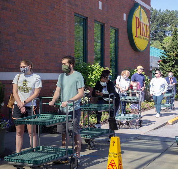 People wait in line to get into the Pike Nursery in Toco Hills. STEVE SCHAEFER / SPECIAL TO THE AJC