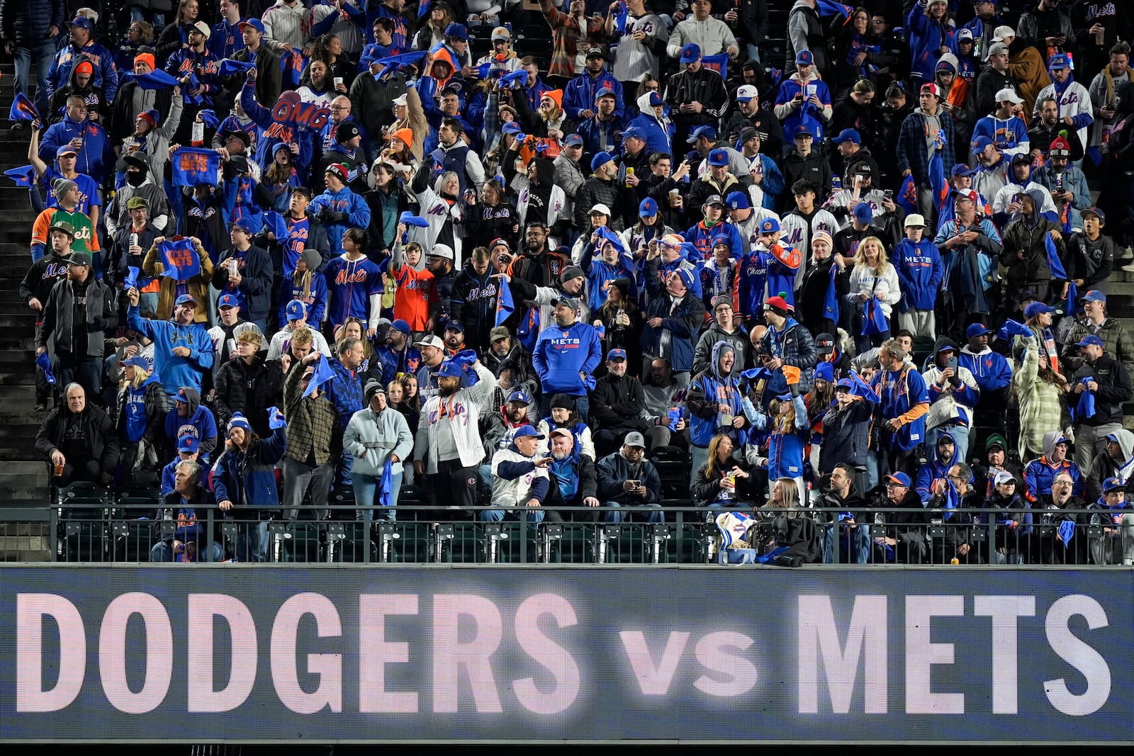 Fans cheer before Game 4 of a baseball NL Championship Series between the Los Angeles Dodgers and the New York Mets, Thursday, Oct. 17, 2024, in New York. (AP Photo/Frank Franklin II)