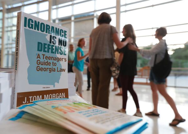 Students and parents arrive for a educational presentation about vaping and the law at Lakeside High School in Atlanta in September. Curtis Compton/ccompton@ajc.com