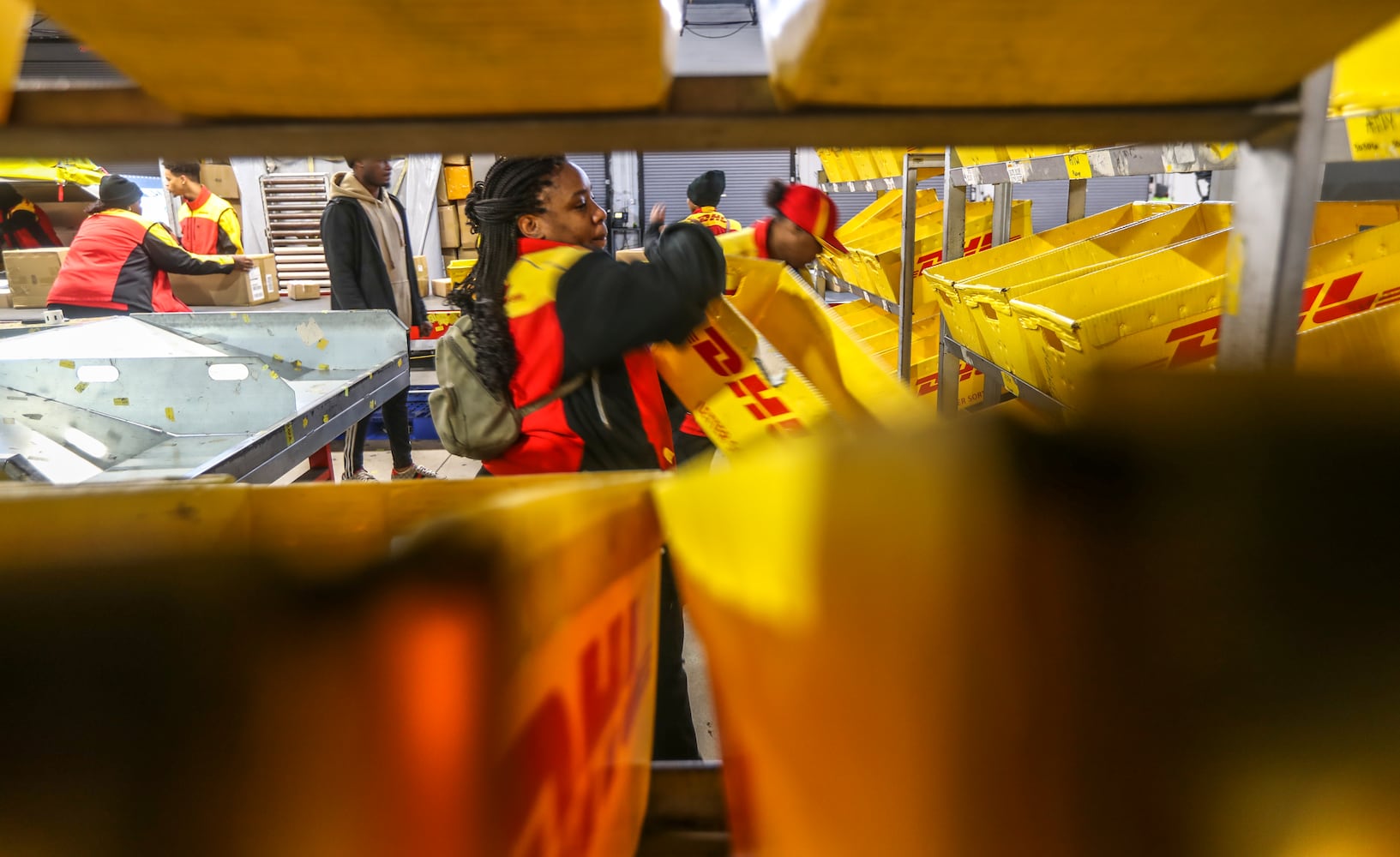 December 15, 2022 ATLANTA: Kearra King sorts packages readying them for transport. (John Spink / John.Spink@ajc.com)

