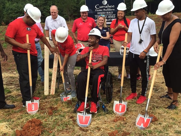 Devon Gales and his family are digging their new homesite. (Steve Hummer/Staff)