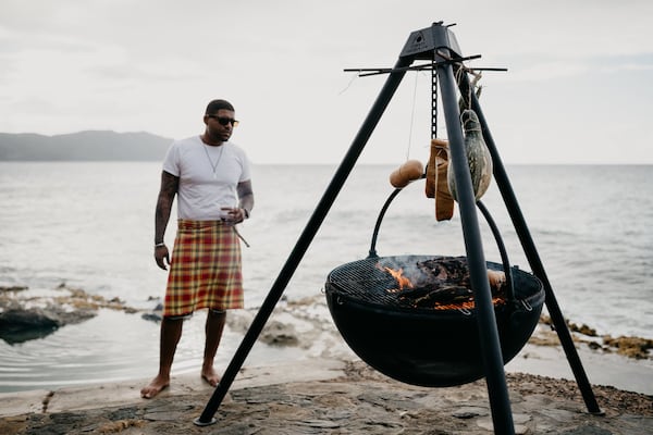 Chef Digby Stridiron grills on the beach adjacent to his restaurant Ama in St. Croix. CONTRIBUTED BY MEREDITH ZIMMERMAN