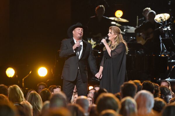 Garth Brooks and Trisha Yearwood share a moment. (Photo by Gustavo Caballero/Getty Images)