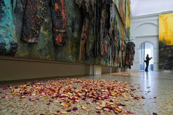 Flower petals are part of the artwork Sag Mir Wo Die Blumen Sind (Where Have All the Flowers Gone), on display at the Stedelijk Museum during a press preview of an Anselm Kiefer exhibit in both the Van Gogh Museum and the Stedelijk Museum in Amsterdam, Netherlands, Wednesday, March 5, 2025. (AP Photo/Peter Dejong)