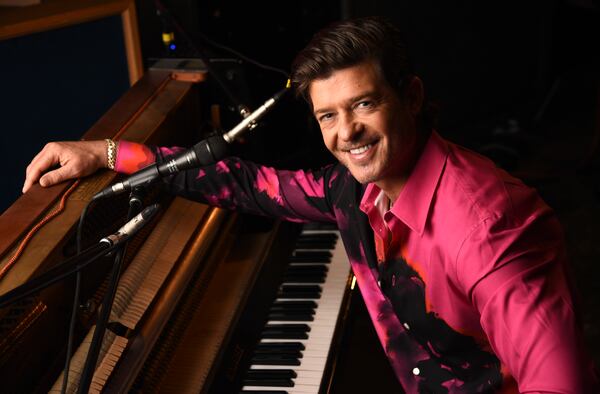 Singer/songwriter Robin Thicke poses for a portrait at Gold Diggers Sound  in Los Angeles on Feb. 3, 2021 to promote his eighth album “On Earth, and In Heaven." He'll perform at this year's Celebrez en Rose in Atlanta on May 7. (AP Photo/Chris Pizzello)