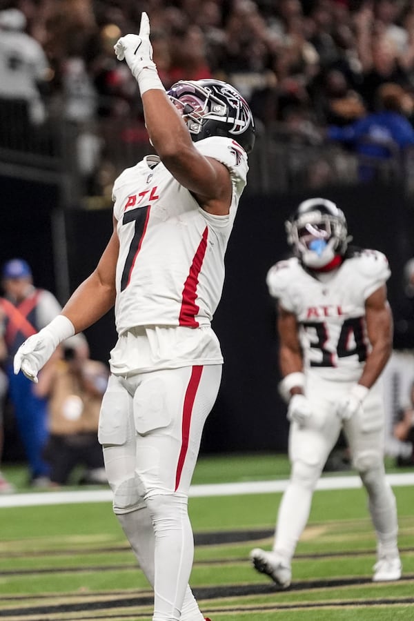 Atlanta Falcons running back Bijan Robinson (7) celebrates his touchdown against the New Orleans Saints during the first half of an NFL football game, Sunday, Nov. 10, 2024, in New Orleans. (AP Photo/Gerald Herbert)