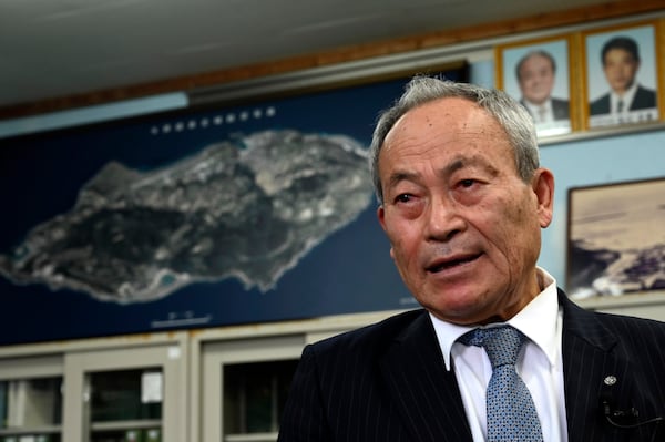 Yonaguni Mayor Kenichi Itokazu speaks during an interview with the AP on Yonaguni, a tiny island on Japan’s western frontier, Friday, Feb. 14, 2025. (AP Photo/Ayaka McGill)