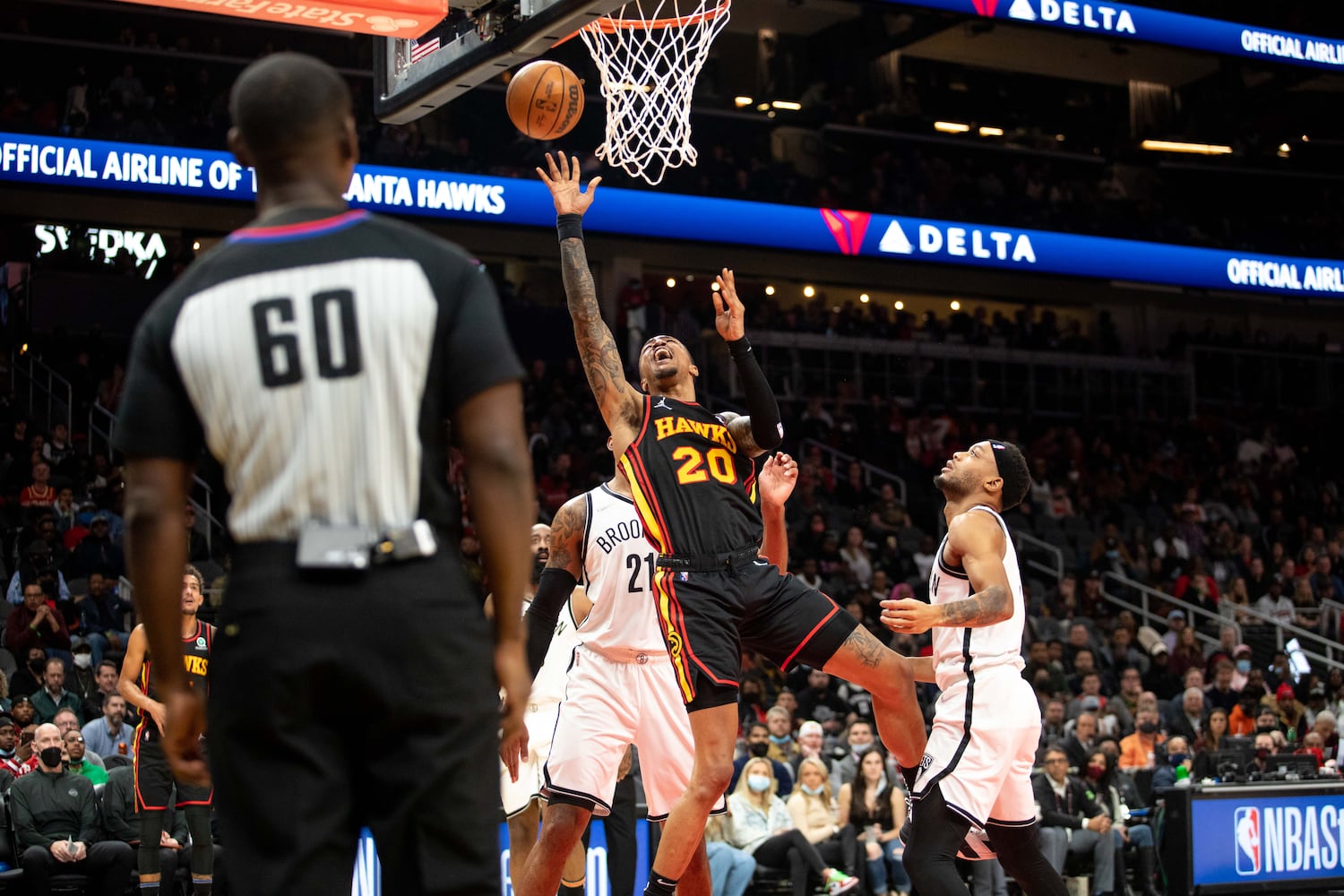 The Hawks' John Collins (20) shoots the ball during a game between the Atlanta Hawks and the Brooklyn Nets at State Farm Arena in Atlanta, GA., on Friday, December 10, 2021. (Photo/ Jenn Finch)