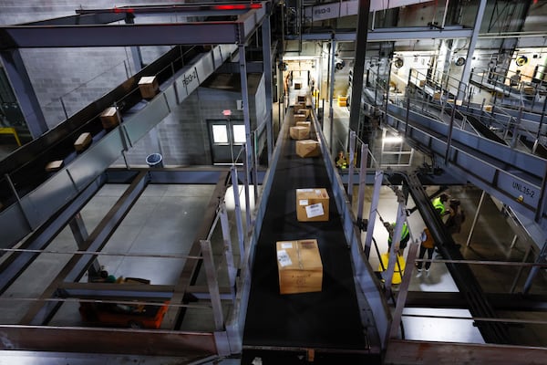 Boxes of Honey Baked Ham products are seen moving on conveyor belts entering the UPS S.M.A.R.T Hub on Wednesday, November 20, 2024. The Honey Baked Ham Company and UPS continue their partnership, ensuring the meals arrive on time for Thanksgiving nationwide.
(Miguel Martinez / AJC)