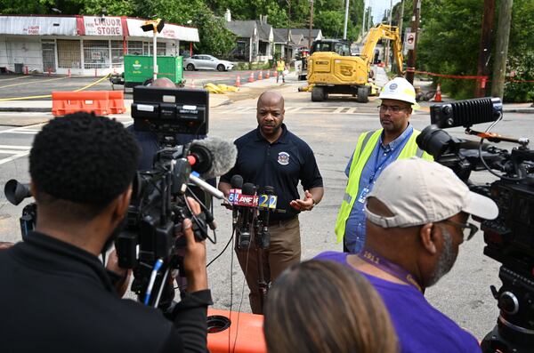 Al Wiggins Jr. Commissioner  of Department of Watershed Management, speaks to members of the press at Joseph E. Boone Boulevard after the water main was repaired.