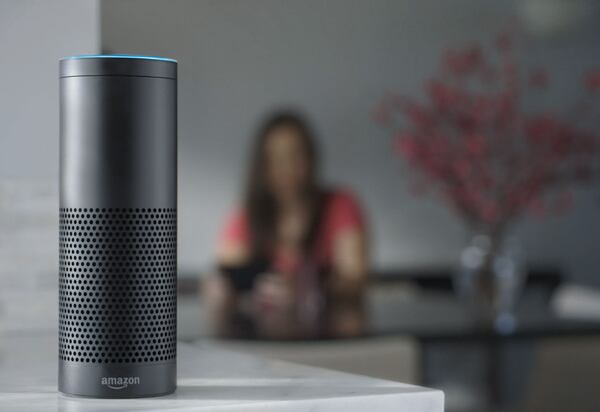 FILE - This file product image provided by Amazon shows the Amazon Echo, the latest advance in voice-recognition technology thats enabling machines to record snippets of conversation that are analyzed and stored by companies promising to make their customers lives better. But the Internet-connected microphones and cameras on the devices are also raising the specter of them being used by corporations or hackers to snoop on private conversations. (Amazon via AP, File)