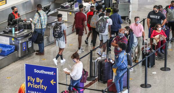 In this file photo, Southwest Airlines was experiencing flight cancellations as travelers crowded the Southwest Counters at Hartsfield-Jackson International Airports domestic terminal. (John Spink / John.Spink@ajc.com)

