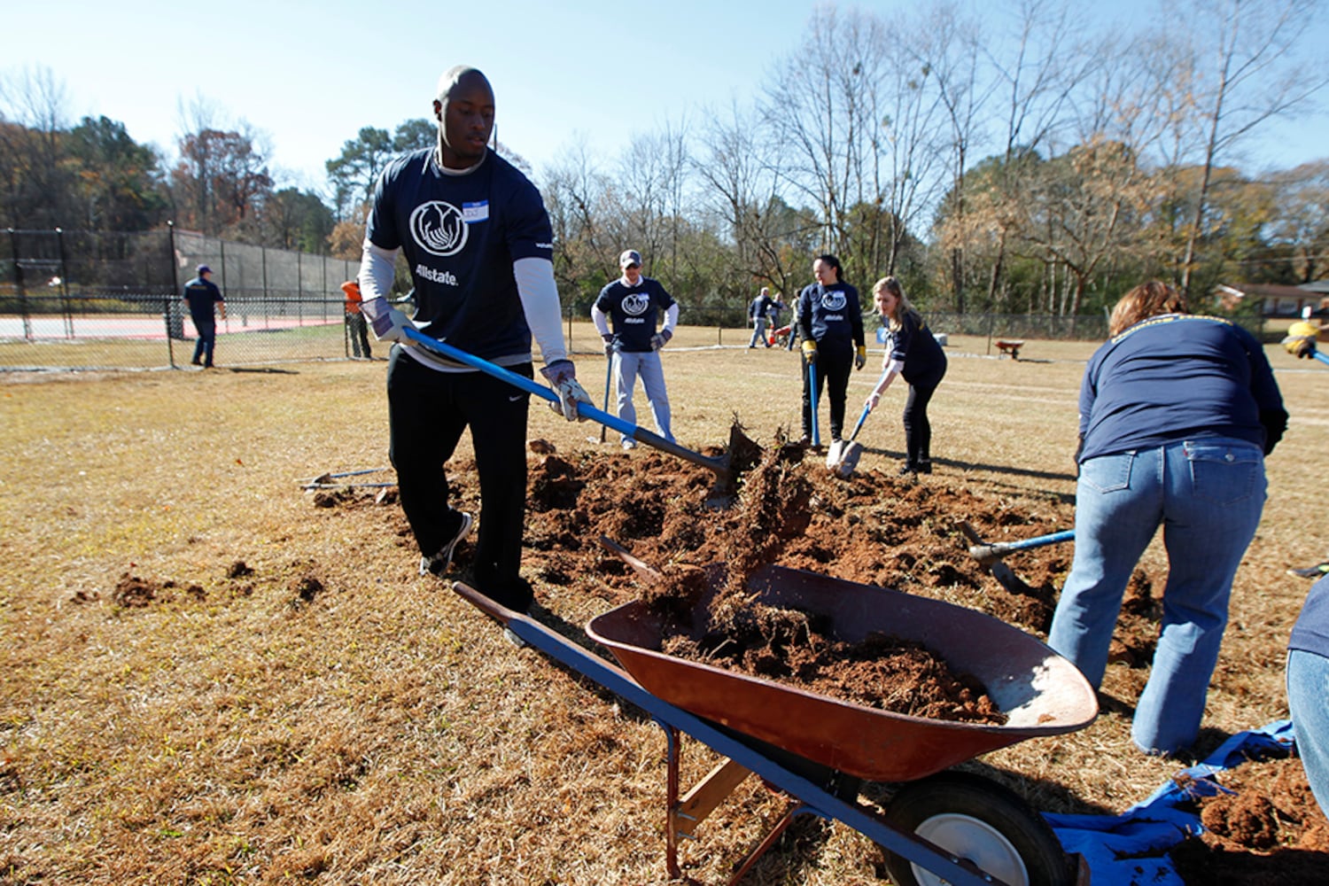 SEC stars build football field in DeKalb