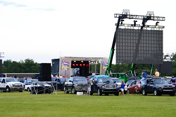 Tailgaters prepare for the Alan Jackson drive-in concert at Oak Hollow Farm in Fairhope, Alabama, on June 13, 2020. (Dreamstime/TNS)