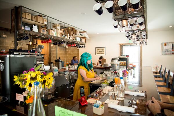  Petit Chou general manager Jennifer Vontillius making drinks behind the bar. Photo credit- Mia Yakel.