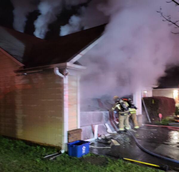 Fire crews deployed two hose lines to put out the fire, which started in the garage, officials said.