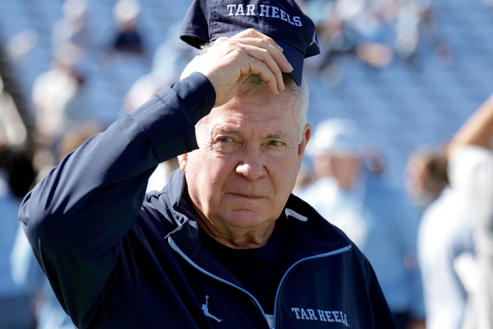 FILE - North Carolina head coach Mack Brown watches the team warm up before an NCAA college football game against Georgia Tech, Oct. 12, 2024, in Chapel Hill, N.C. (AP Photo/Chris Seward, File)