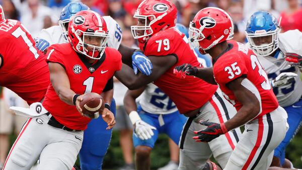 Georgia Bulldogs quarterback Justin Fields (1) hands off to running back Brian Herrien in the second half Saturday, Sept 15, 2018, against Middle Tennessee at Sanford Stadium in Athens.