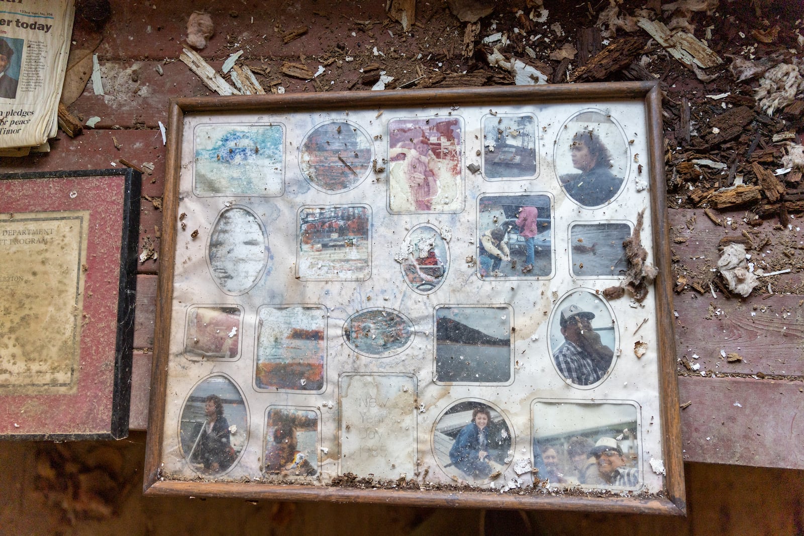 Old photos are seen inside the circa 1840 Power-Jackson Cabin in Marietta on Monday, December 4, 2023. The Cobb Landmarks + Historical Society hopes to restore and move the building. (Arvin Temkar / arvin.temkar@ajc.com)