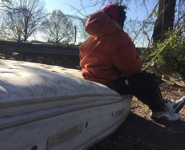 Audrey Galex of Atlanta took this photo of an unidentified man seated on an abandoned mattress, one of many strewn across the city. CONTRIBUTED BY AUDREY GALEX