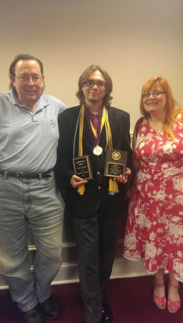 Scout Schultz (center) is shown with father, Bill, and mother Lynne in this family photo. Photo Provided by the Schultz Family.