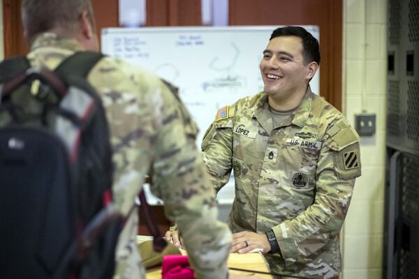 FORT STEWART, GA - NOVEMBER 15, 2023: 
Sgt. 1st Class Nathan Lopez, right, is assigned to the Marne Innovation Center at Fort Stewart, a military makerspace outfitted with powerful design computers, 3-D printers and fabrication equipment. The center has produced dozens of innovations in its short history, such as a plastic clip that makes an ammo pouch for belt-loaded machine guns more easily accessible. (AJC Photo/Stephen B. Morton)