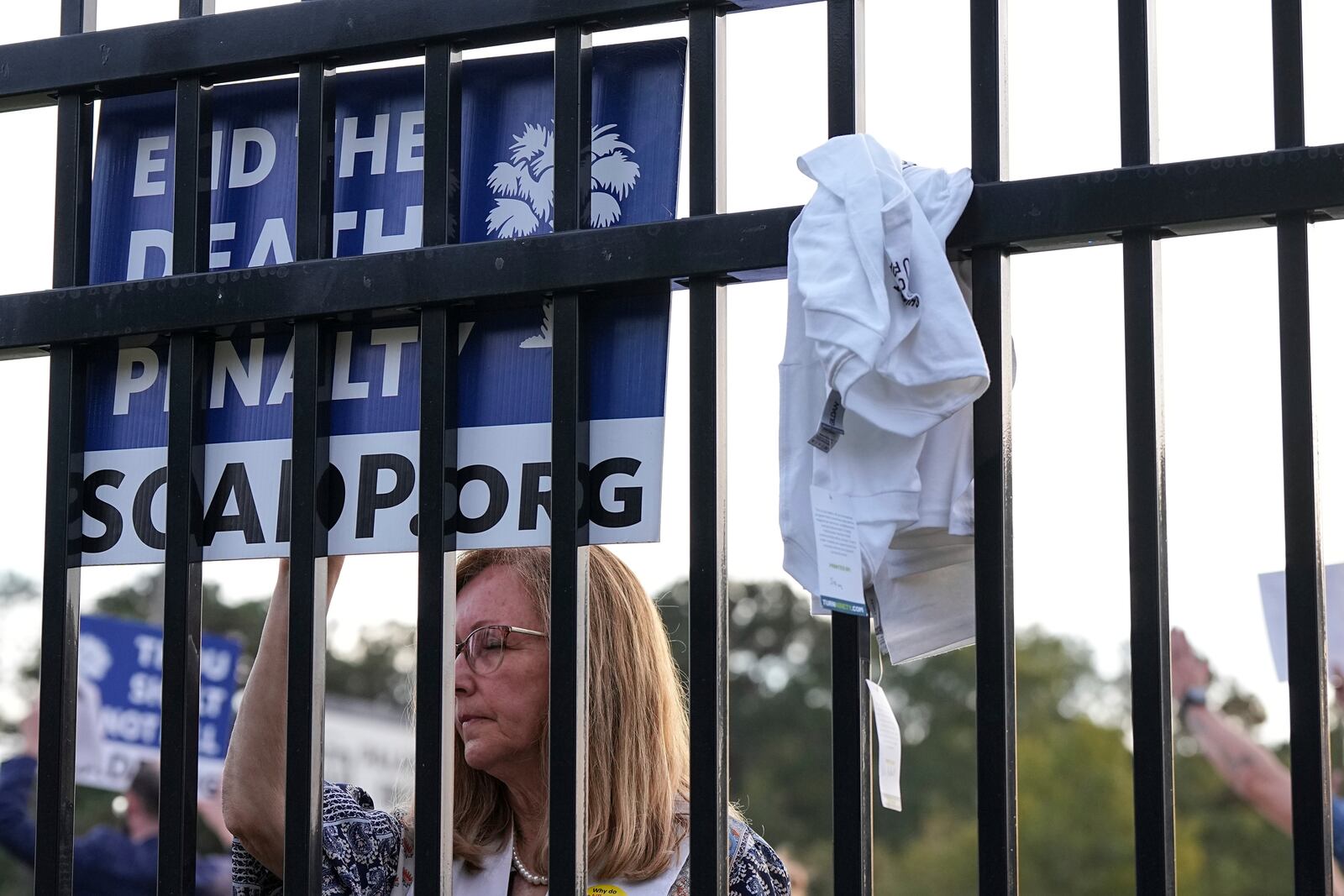 A protestor looks on prior to the scheduled execution of Richard Moore outside of Broad River Correctional Institution, Friday, Nov. 1, 2024, in Columbia , S.C. (AP Photo/Matt Kelley)