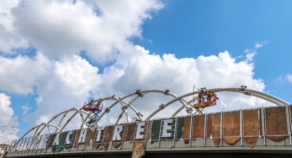 Under cloudy skies, welders continued work on the gateway arch elements in phase II of the Peachtree Bridge Enhancement project at the Brookwood Interchange on Monday, June 12, 2017. Showers are expected throughout the day, according to Channel 2 Action News. JOHN SPINK / JSPINK@AJC.COM.