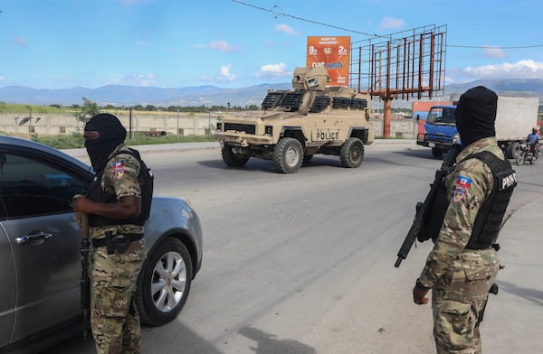 Police officers patrol near the Toussaint Louverture International Airport in Port-au-Prince, Haiti, Tuesday, Nov. 12, 2024. (AP Photo/Odelyn Joseph)