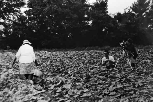 A photo showing Doris Derby (at right) photographing in Ruleville, Mississippi, in 1968. Derby, who worked with the Student Nonviolent Coordinating Committee during the Albany movement and documented the struggle in film and photographs. BOB ANDRES / BANDRES@AJC.COM