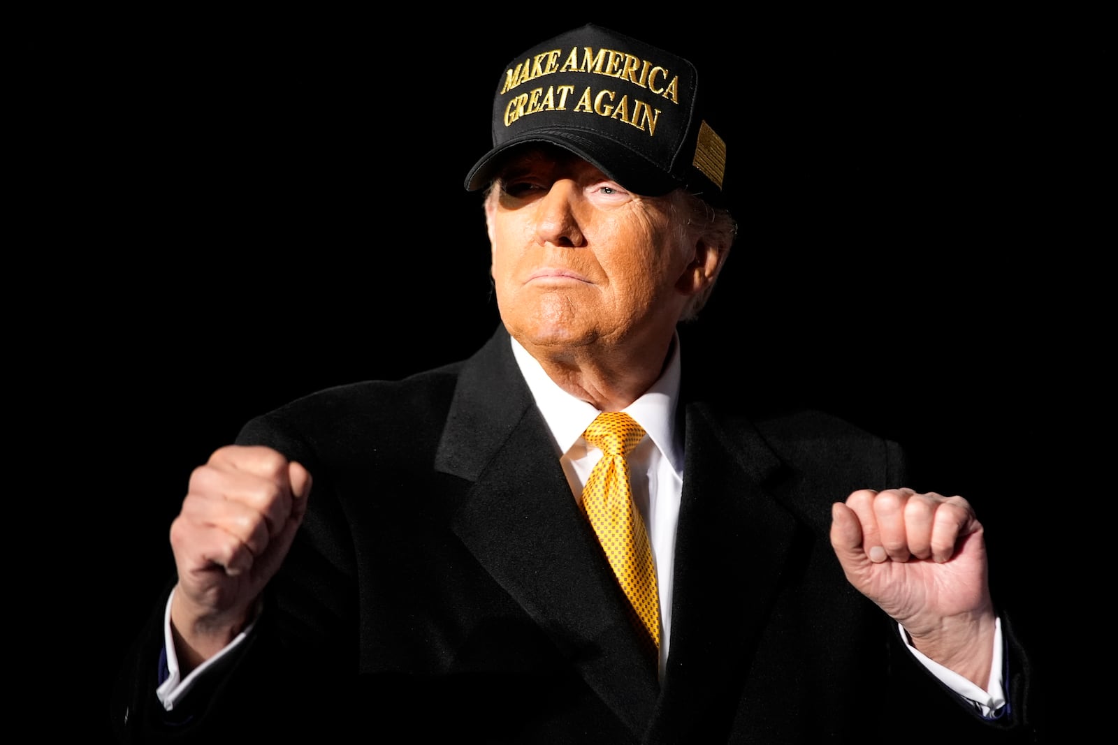 Republican presidential nominee former President Donald Trump walks off stage after speaking at a campaign rally at Cherry Capital Airport, Friday, Oct. 25, 2024, in Traverse City, Mich. (AP Photo/Alex Brandon)