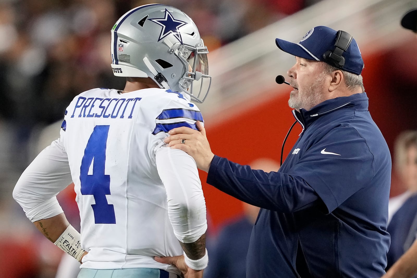 Dallas Cowboys quarterback Dak Prescott (4) talks with head coach Mike McCarthy during the first half of an NFL football game against the San Francisco 49ers in Santa Clara, Calif., Sunday, Oct. 27, 2024. (AP Photo/Tony Avelar)